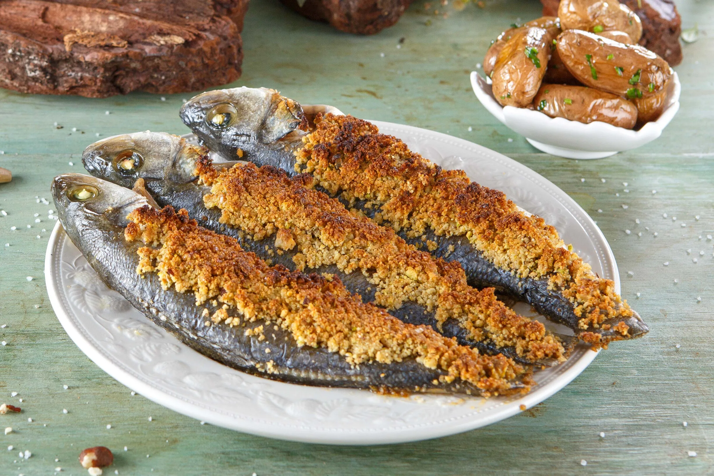 Robalo com crosta de pistácio e noz